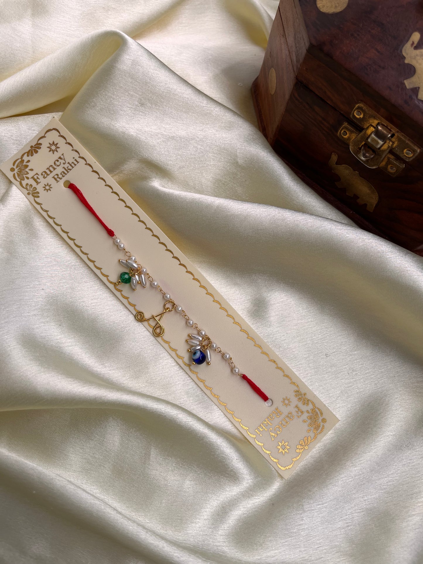 Name initials Rakhi with evil eye beads