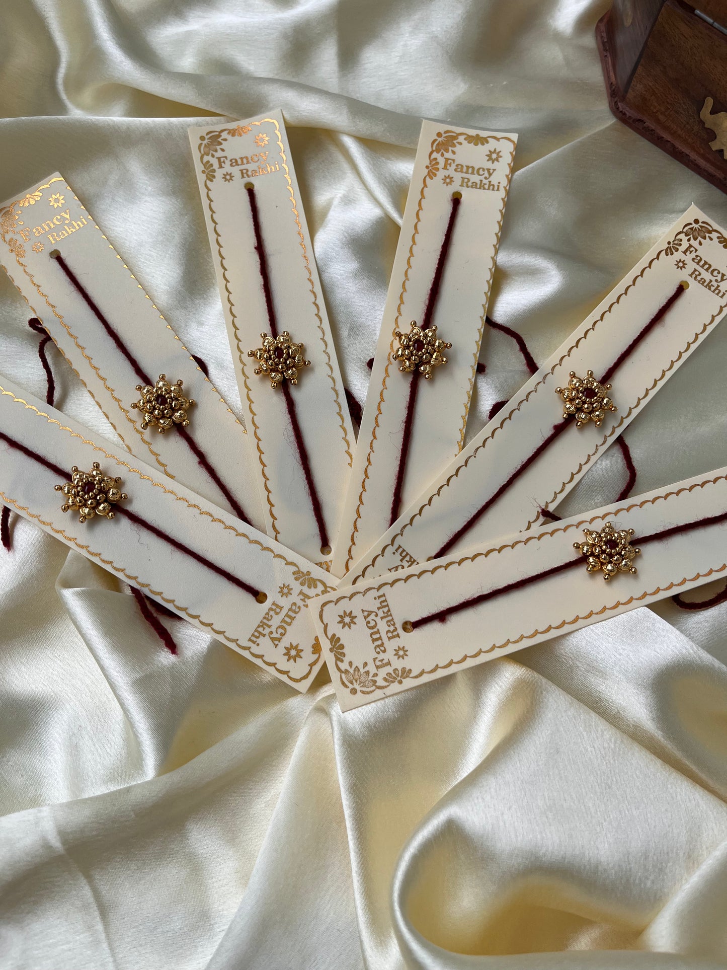 Golden flower Rakhi( pack of 6 Rakhi’s )