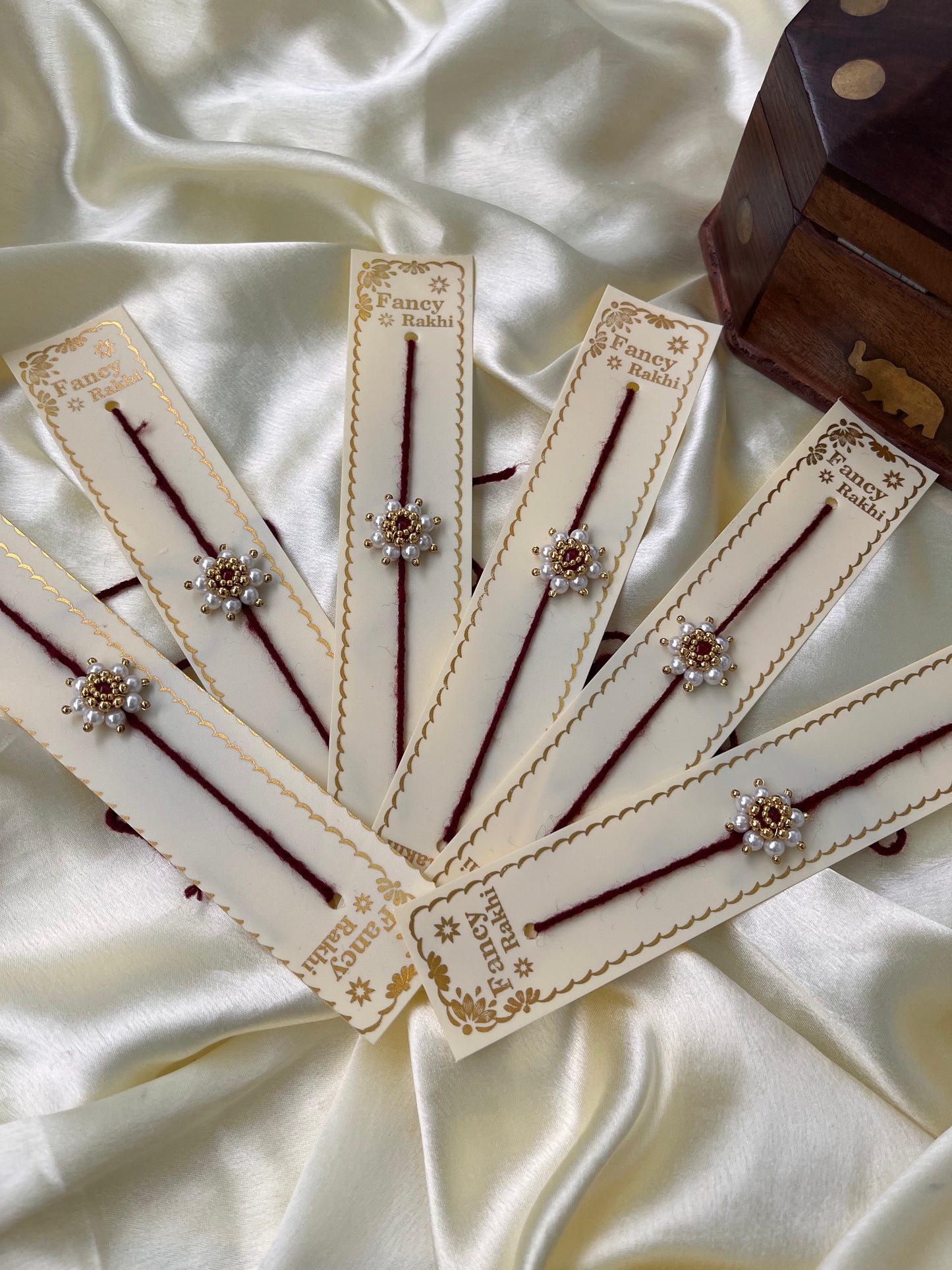 Pearl flower Rakhi ( pack of 6 )